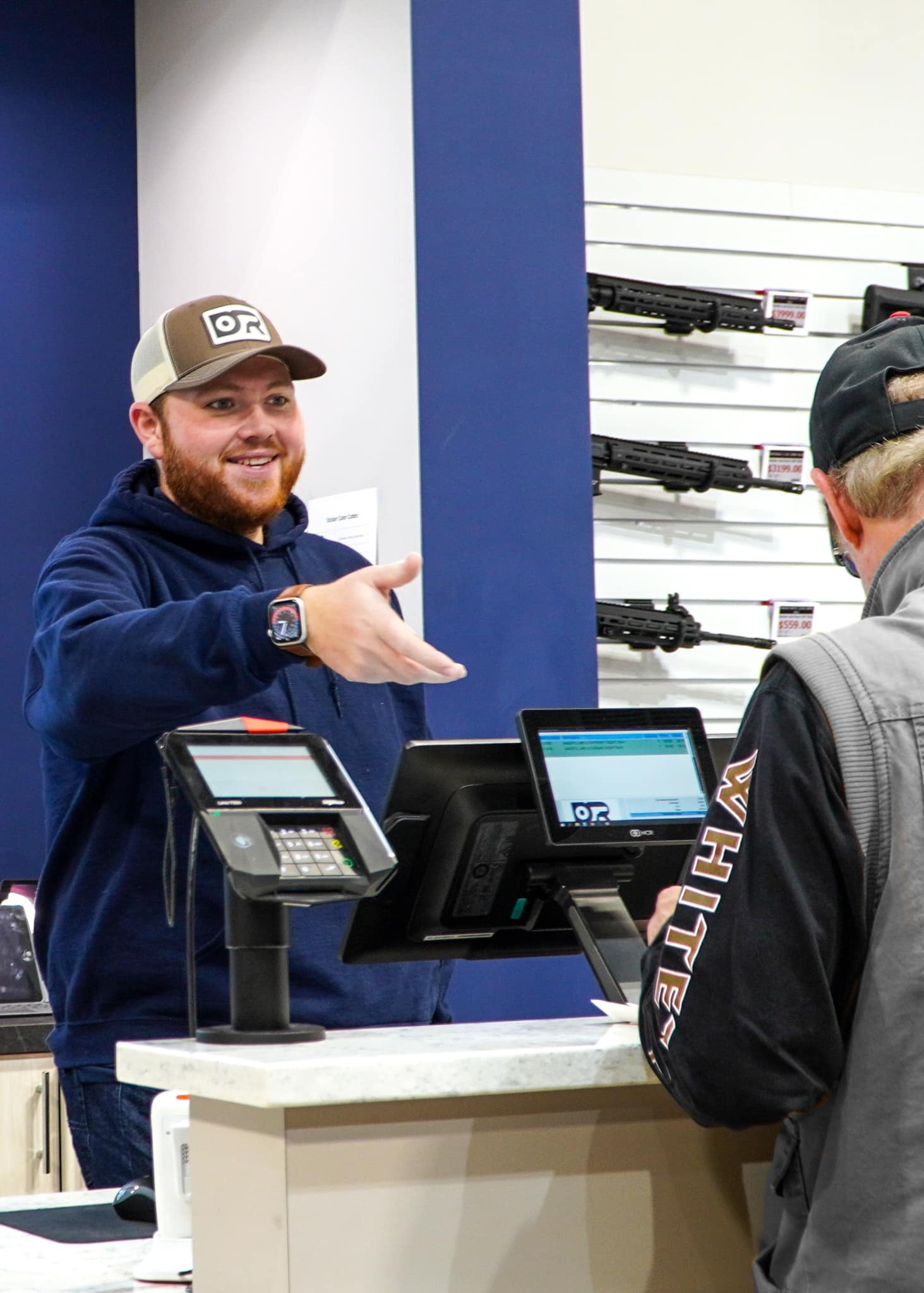 Down Range Guns & Ammo Owner helping a customer