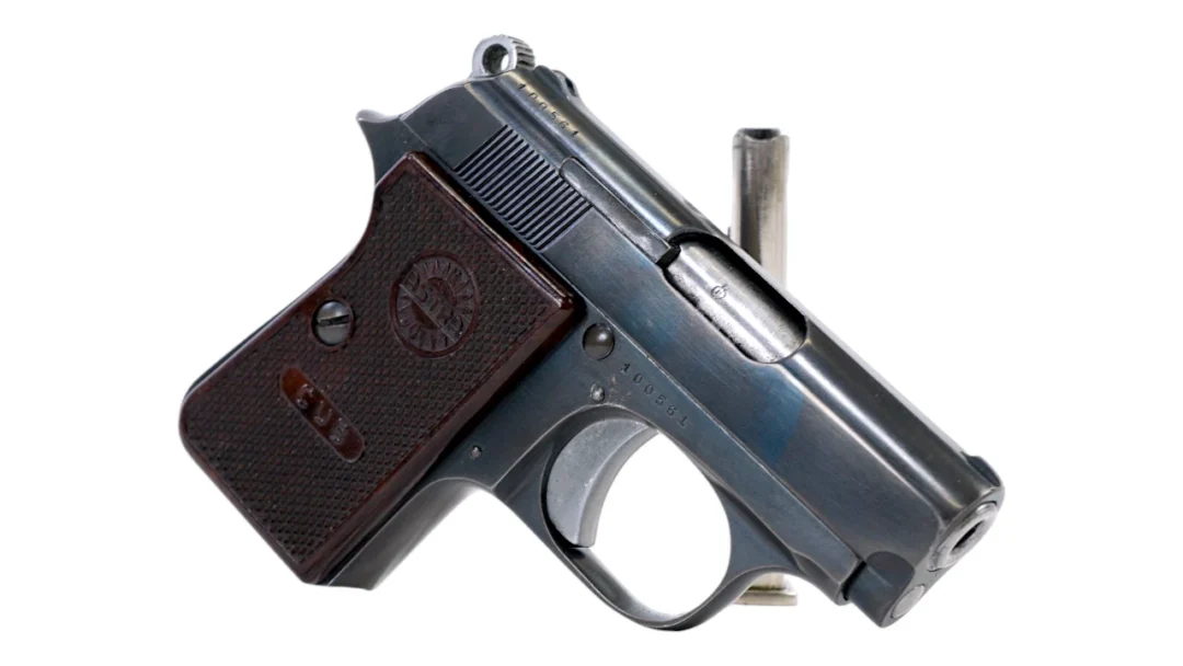 Semi-automatic pistol with a brown textured grip on a white background.