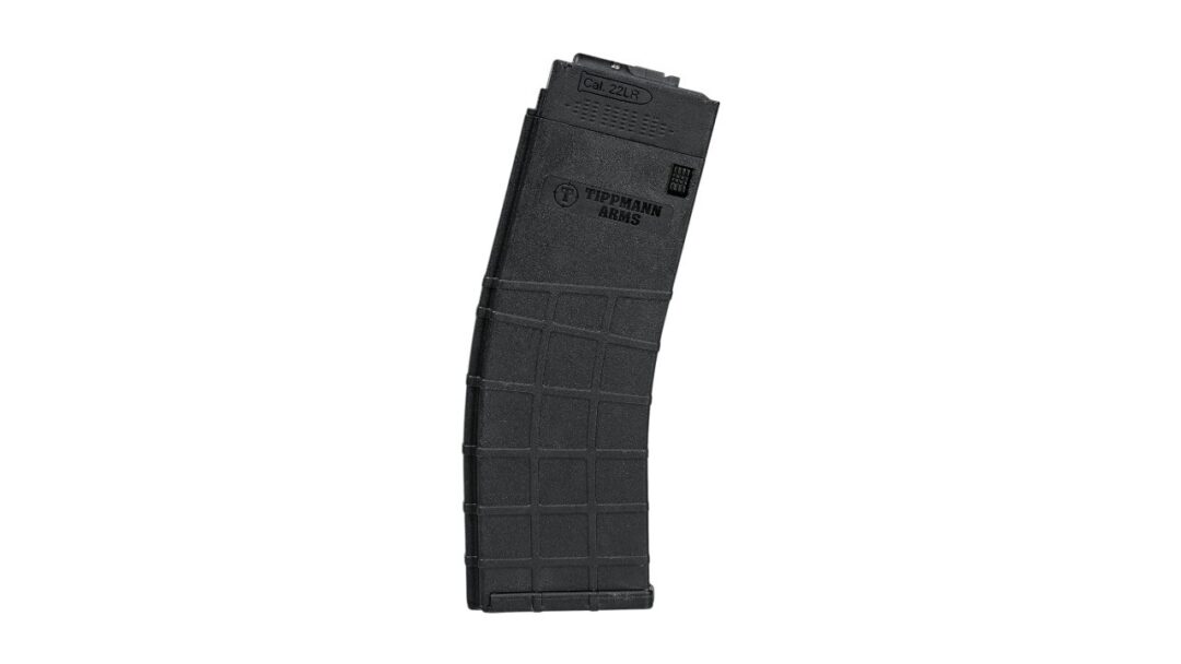 Black curved rifle magazine marked 'Cal. .22LR' with Tippmann Arms logo, textured grid pattern along the body.