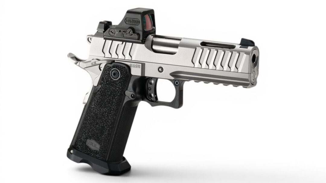 Semi-automatic handgun seen from the side, with a textured grip, silver slide, and front accessory rail. It has a small red-dot sight mounted on top.