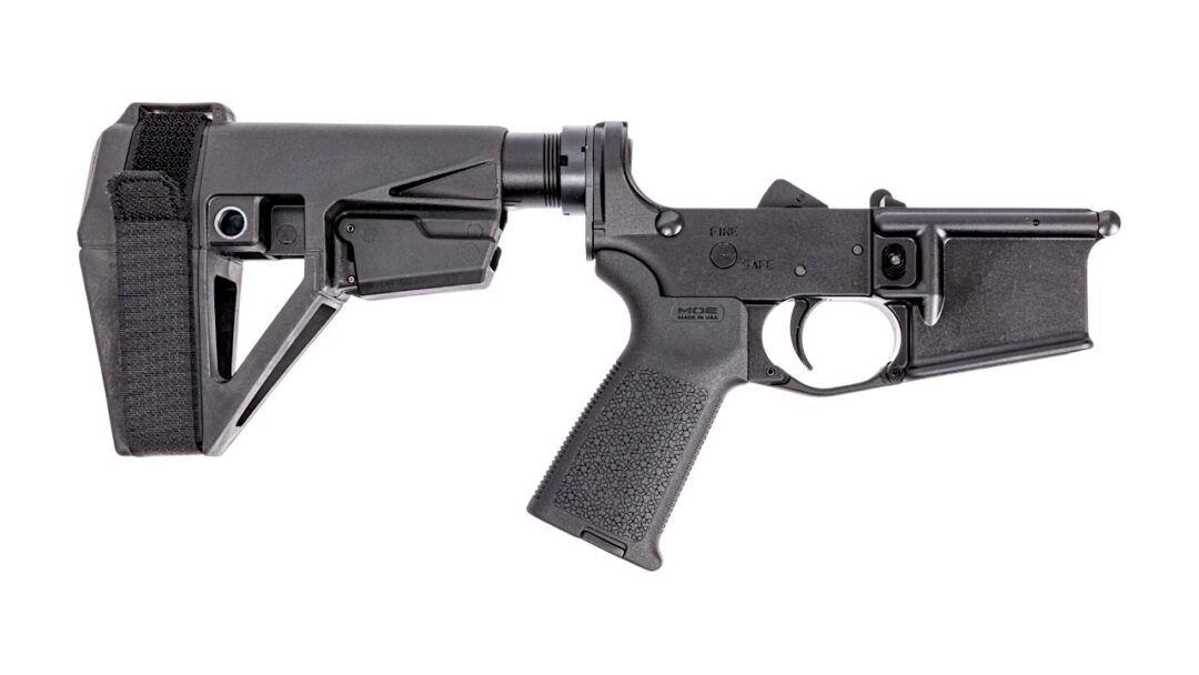 Side view of a black tactical rifle with collapsible stock and textured pistol grip.