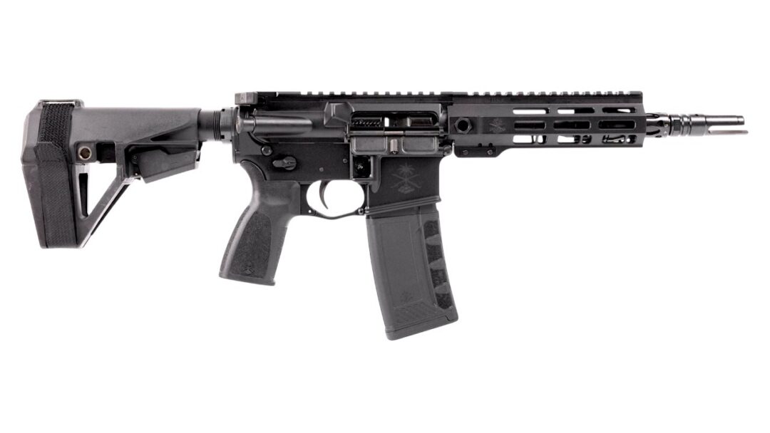 Black semi-automatic rifle laid horizontally, featuring an adjustable stock, pistol grip, long polymer magazine, and a cutout handguard with a rails system and muzzle device on the right.