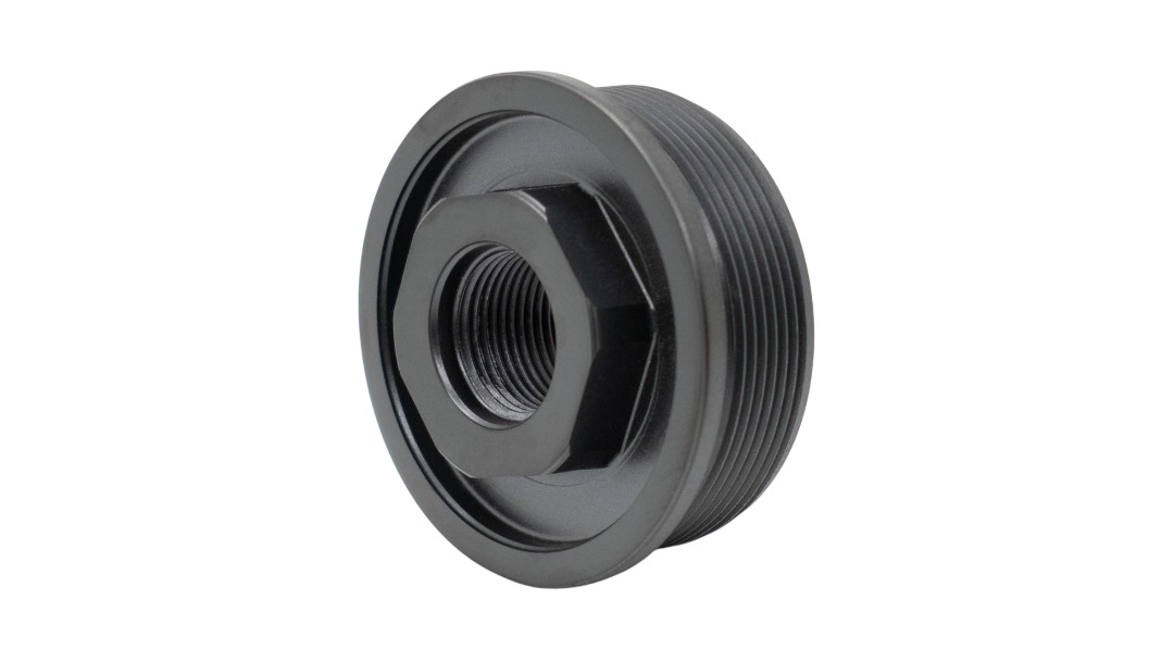 Black metal threaded adapter with hexagonal inner bore and external threads used to join components
