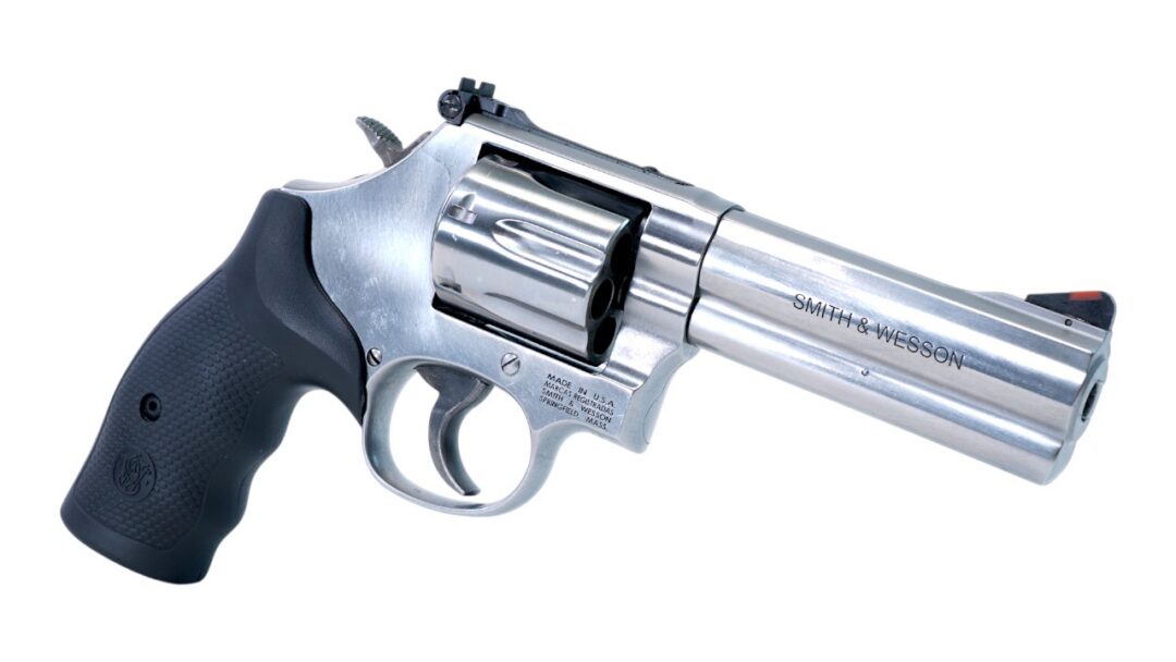 Silver revolver with a black textured grip, shown in side view; 'Smith & Wesson' engraved on the barrel