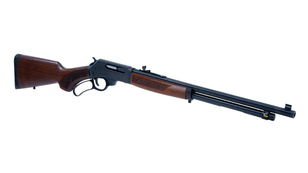 Lever-action rifle with wooden stock and long blue-black barrel on a white background.