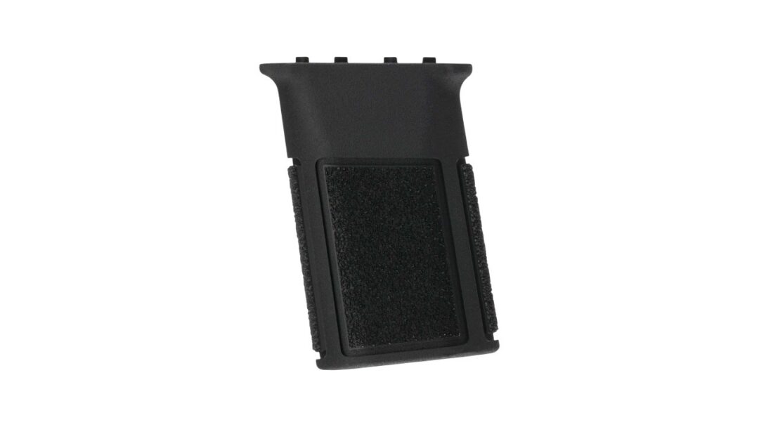 Black plastic grip accessory with textured foam on the sides, angled rectangular shape.
